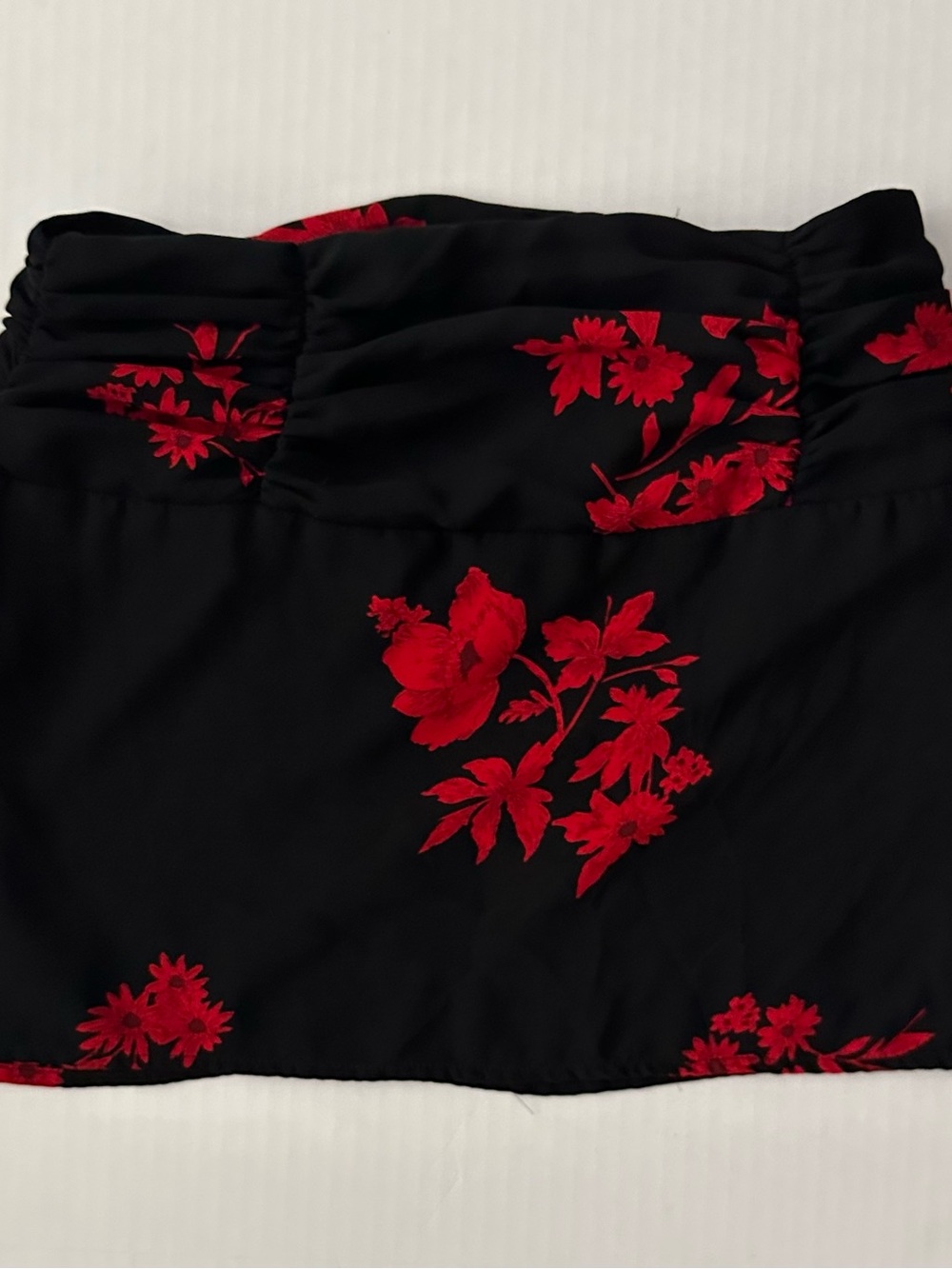 Princess Polly Black Skirt with Red Floral Accent